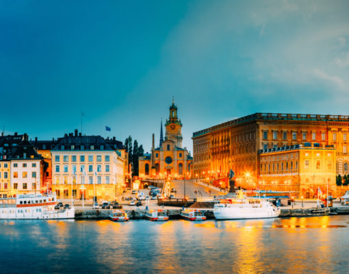 Stockholm, Sweden. Scenic View Of Embankment In Old Part Of Stockholm At Summer Evening, Sweden. Panorama. Famous Cityscape At Sunset Time. Popular Tourist Place.